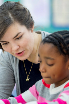 teacher and students reading together