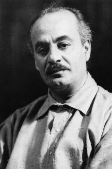 A black-and-white photo of Kahlil Gibran, renowned Arab American poet and author, celebrating his contributions for Arab American Heritage Month.