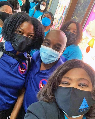 Marie Etienne, bottom, with colleagues en route to the border.