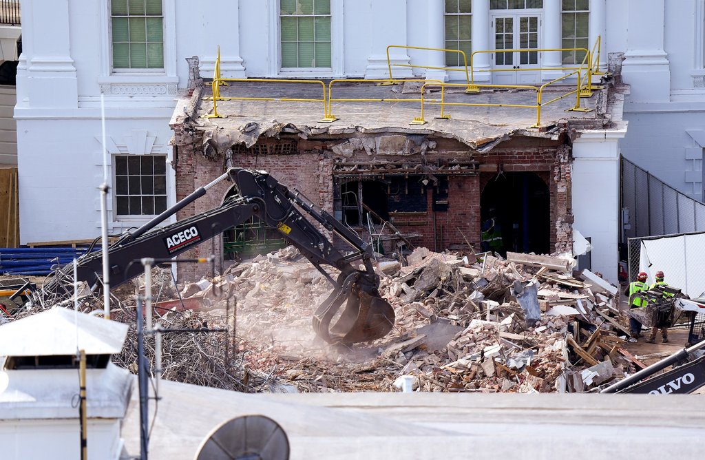 WASHINGTON, DC - OCTOBER 23: An excavator works to clear rubble after the East Wing of the White House was demolished on October 23, 2025 in Washington, DC. The demolition is part of U.S. President Donald Trump's plan to build a multimillion-dollar ballroom on the eastern side of the White House. (Photo by Eric Lee/Getty Images)